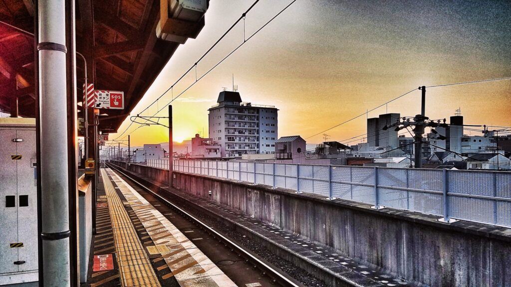 waiting for the bullet train to arrive in Kyoto, Japan, admiring the sunrise