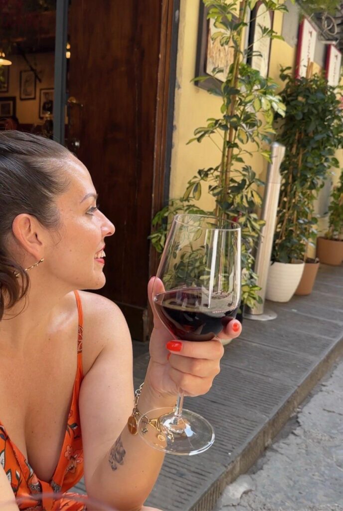 Linds drinking tempranillo in Europe