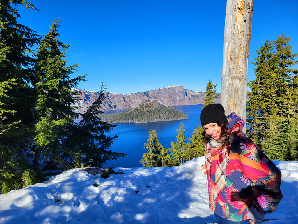Linds standing in the snow, overlooking Crater Lake