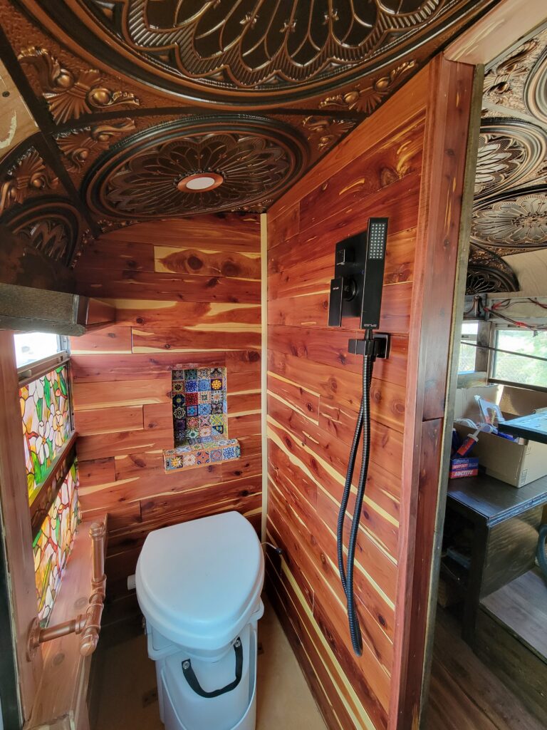 The Wow Wagon's tiny bathroom and beautiful faux tin ceilings