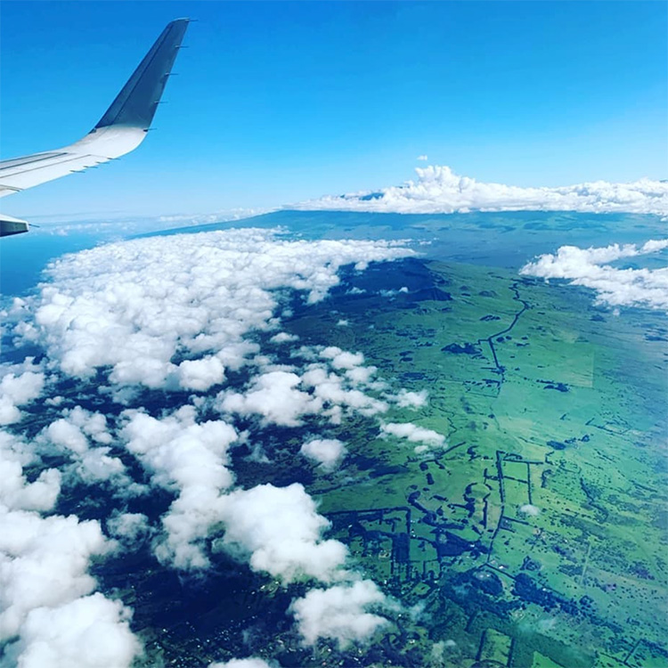 Aerial view from airplane with view of airplane wing