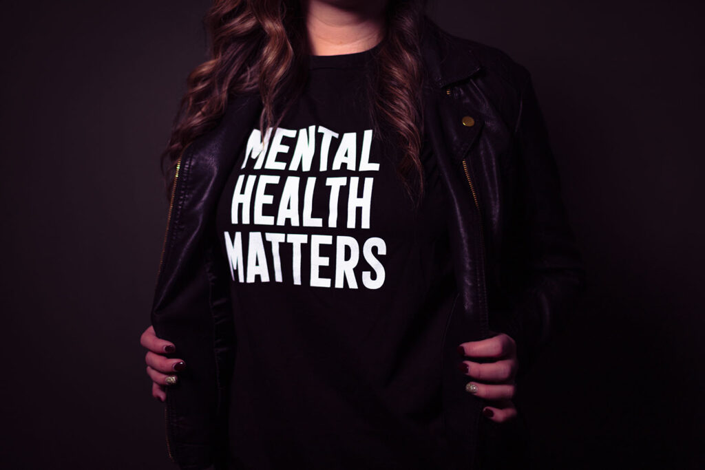 woman wearing a shirt that says "mental health matters"