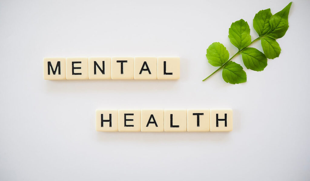 mental health spelled out with scrabble-like tiles