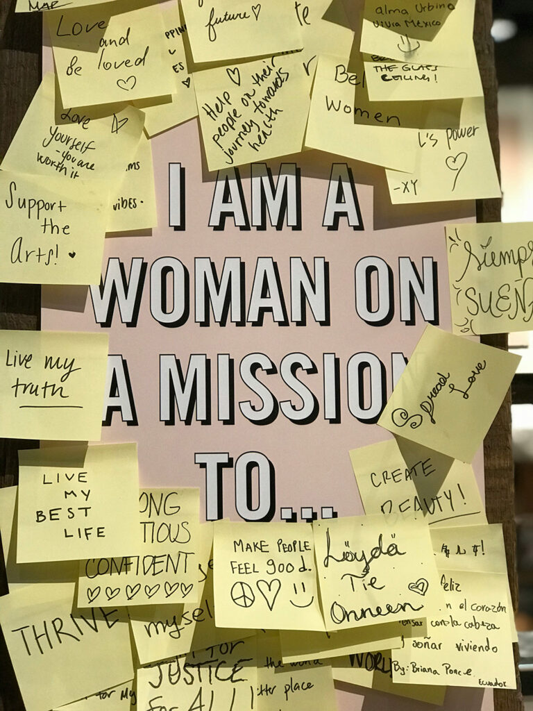 I am a woman on a mission to... surrounded by yellow post-its that say various things like "live my best life"