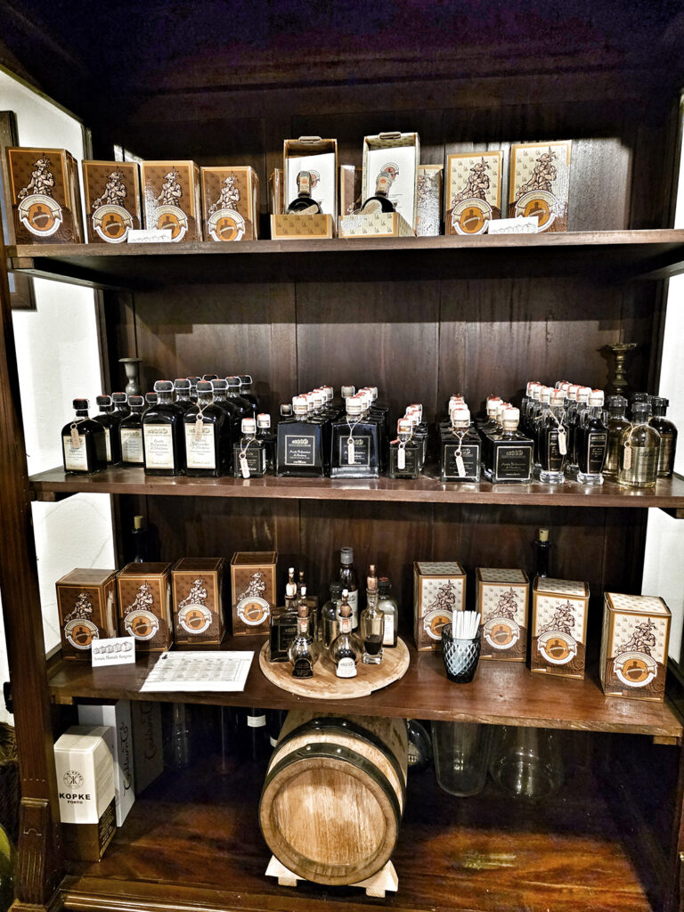 Shelf of red cap, silver cap, and gold cap Balsamic Vinegars of Modena